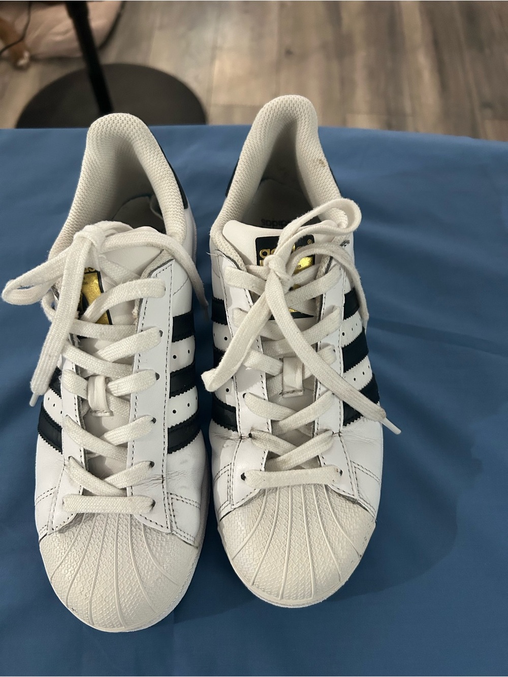 adidas Kids White Sneakers with Black Stripes and Gold Tongue Accents